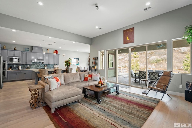 9179 Graycliff Ln, Reno, NV 89523 - living room featuring light wood-style floors and recessed lighting
