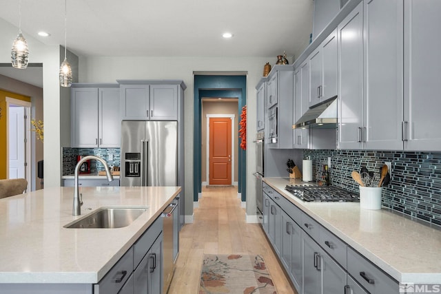 9179 Graycliff Ln, Reno, NV 89523 - kitchen featuring a sink, under cabinet range hood, appliances with stainless steel finishes, gray cabinetry, and recessed lighting