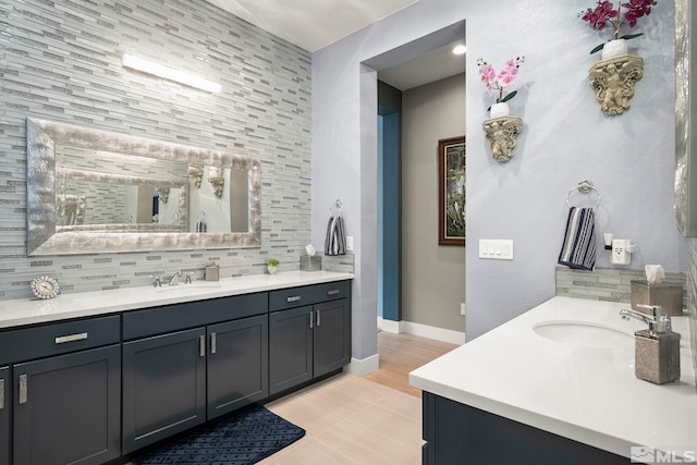 9179 Graycliff Ln, Reno, NV 89523 - full bath with decorative backsplash, two vanities, and baseboards