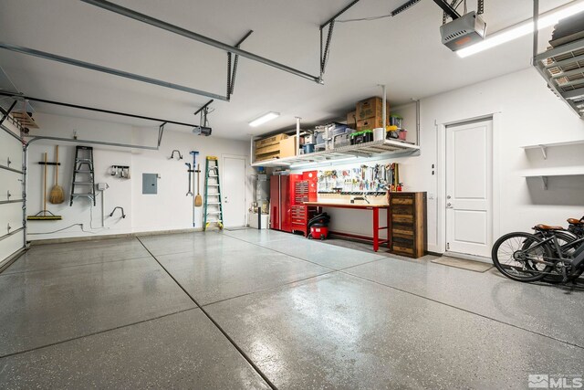 9179 Graycliff Ln, Reno, NV 89523 - garage featuring a garage door opener, a workshop area, and electric panel