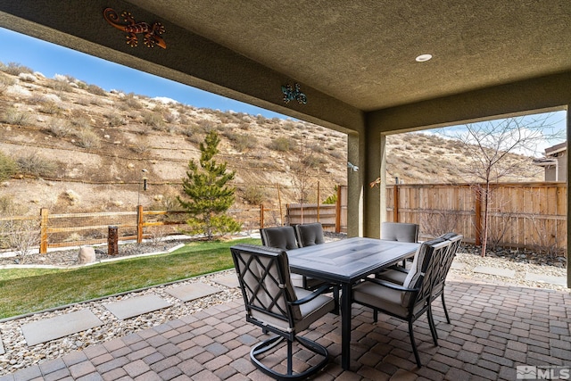9179 Graycliff Ln, Reno, NV 89523 - view of patio / terrace with outdoor dining area and a fenced backyard