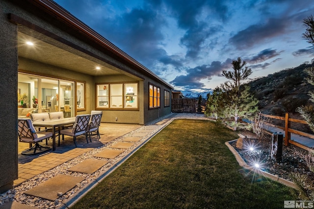 9179 Graycliff Ln, Reno, NV 89523 - yard at dusk featuring a patio area