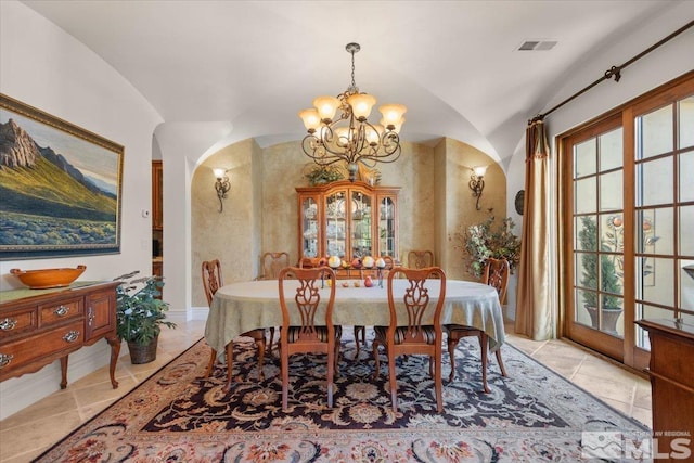 dining room with a chandelier, arched walkways, and lofted ceiling