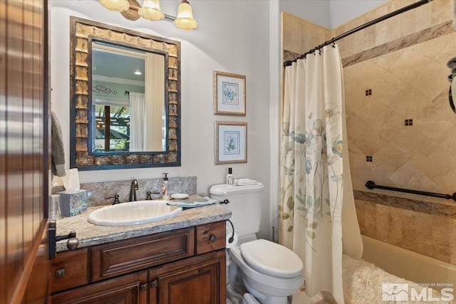 full bathroom with toilet, vanity, and shower / tub combo