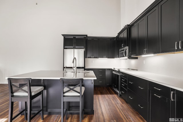 8 Katherine Ct, Stateline, NV 89449 - kitchen with appliances with stainless steel finishes, dark cabinets, dark wood finished floors, and light countertops