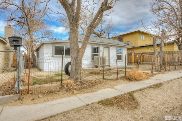 742 D St, Hawthorne, NV 89415 - view of front facade with a fenced front yard and roof with shingles