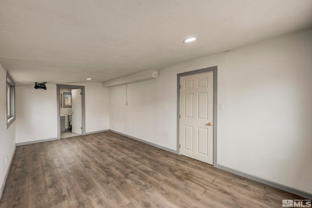 742 D St, Hawthorne, NV 89415 - spare room with wood finished floors, recessed lighting, and baseboards