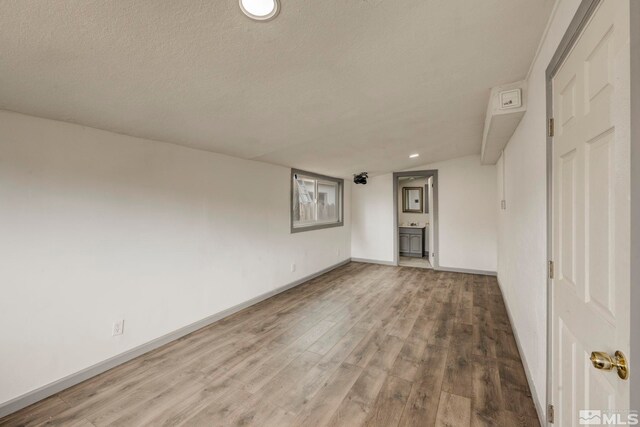 742 D St, Hawthorne, NV 89415 - unfurnished room featuring wood finished floors, baseboards, a textured ceiling, and recessed lighting