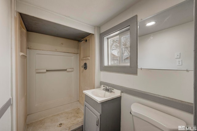 742 D St, Hawthorne, NV 89415 - full bathroom featuring a shower stall, toilet, vanity, and recessed lighting