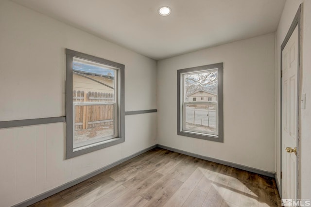 742 D St, Hawthorne, NV 89415 - unfurnished bedroom featuring multiple windows, light wood-type flooring, and recessed lighting