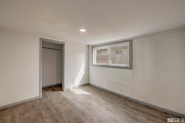 742 D St, Hawthorne, NV 89415 - unfurnished bedroom with wood finished floors, recessed lighting, baseboards, and a closet