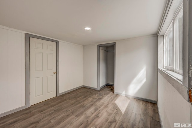 742 D St, Hawthorne, NV 89415 - unfurnished bedroom with wood finished floors, baseboards, a closet, and recessed lighting