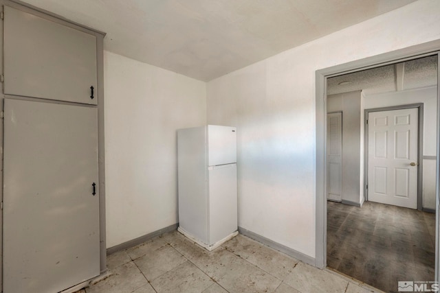 742 D St, Hawthorne, NV 89415 - kitchen with freestanding refrigerator and baseboards