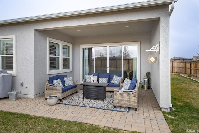 view of patio / terrace with an outdoor hangout area and fence