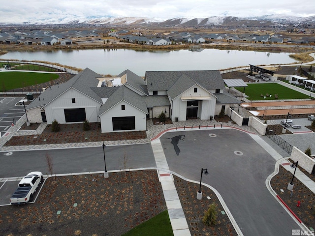 aerial perspective of suburban area with a nearby body of water