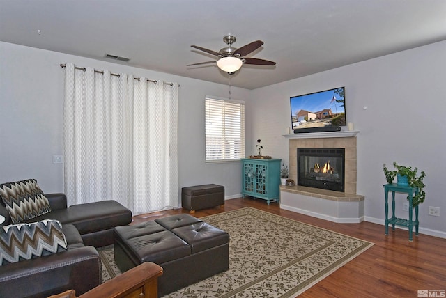 3953 Boundary Peak Ct, Reno, NV 89508 - living area featuring ceiling fan, a fireplace, wood finished floors, and baseboards