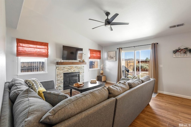 9834 Suncrest Dr, Reno, NV 89506 - living room with wood finished floors, ceiling fan, baseboards, a fireplace, and vaulted ceiling