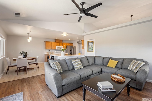 9834 Suncrest Dr, Reno, NV 89506 - living area with lofted ceiling, light wood-style floors, a ceiling fan, baseboards, and recessed lighting