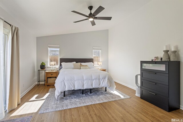 9834 Suncrest Dr, Reno, NV 89506 - bedroom with wood finished floors, baseboards, ceiling fan, and high vaulted ceiling