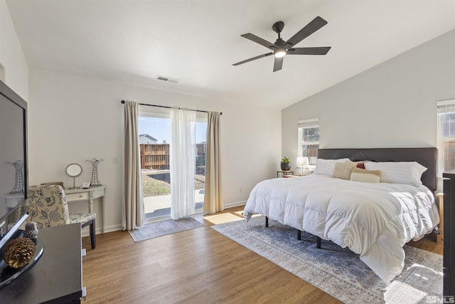 9834 Suncrest Dr, Reno, NV 89506 - bedroom with multiple windows, access to outside, wood finished floors, and vaulted ceiling