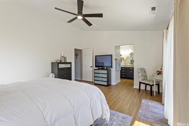 9834 Suncrest Dr, Reno, NV 89506 - bedroom featuring lofted ceiling, wood finished floors, ceiling fan, baseboards, and connected bathroom