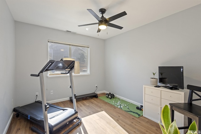 9834 Suncrest Dr, Reno, NV 89506 - workout room featuring light wood-style floors, a ceiling fan, and baseboards