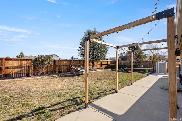 9834 Suncrest Dr, Reno, NV 89506 - view of yard with a storage unit, a patio, and an outdoor structure