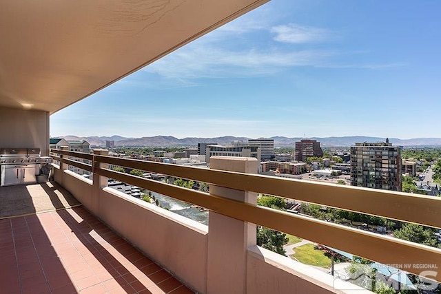100 N Arlington Ave Unit 14F, Reno, NV 89501 - balcony with a mountain view, exterior kitchen, and a city view