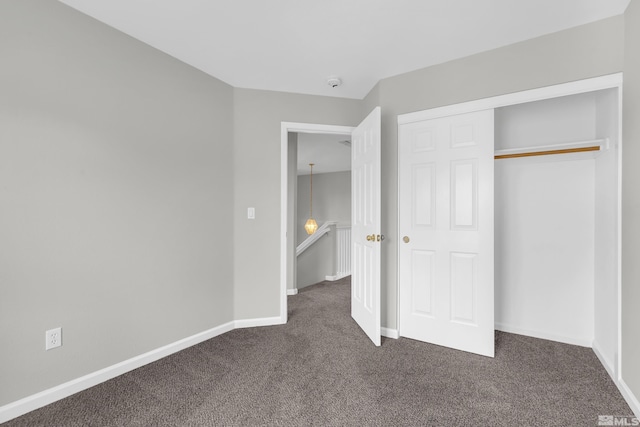 2130 Canyon Mesa Ct, Reno, NV 89523 - unfurnished bedroom with dark colored carpet, baseboards, and a closet