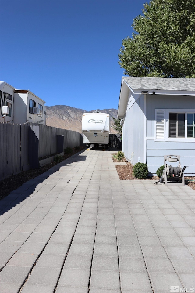 255 Ash St, Hawthorne, NV 89415 - exterior view of fence, driveway, and a mountain view