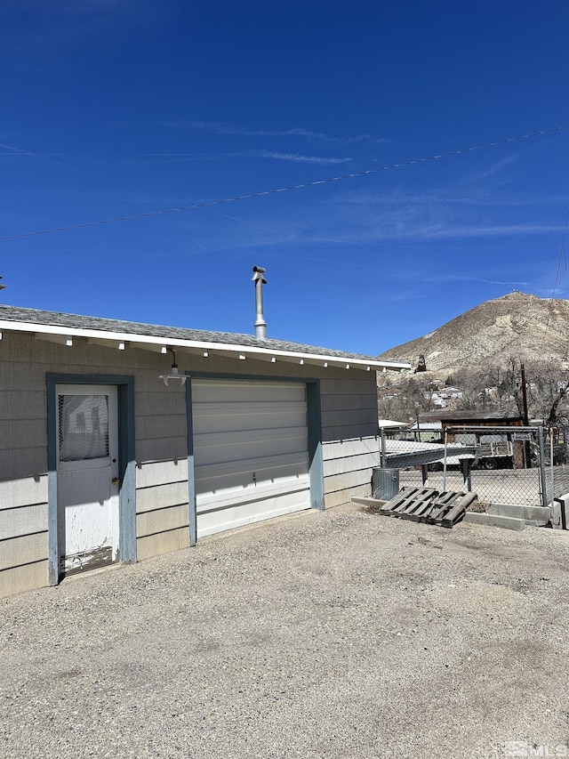 481 S Frankie St, Tonopah, NV 89049 - garage with a mountain view and fence