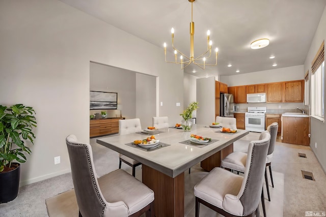 10055 Zephyr Heights Dr, Reno, NV 89521 - dining room featuring a chandelier, baseboards, and recessed lighting