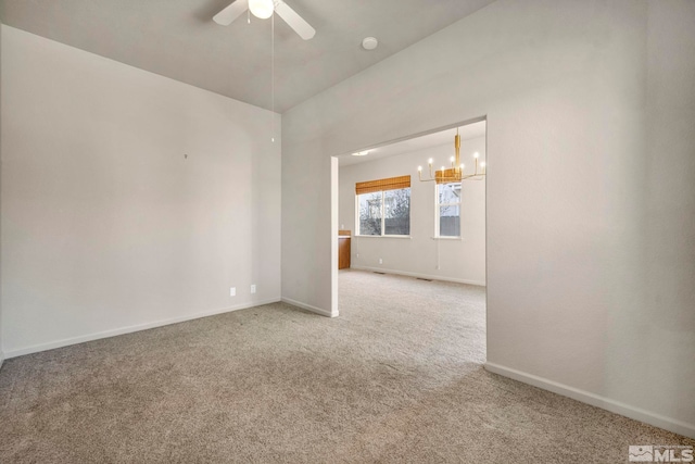 10055 Zephyr Heights Dr, Reno, NV 89521 - unfurnished room with light carpet, a ceiling fan, baseboards, and a chandelier