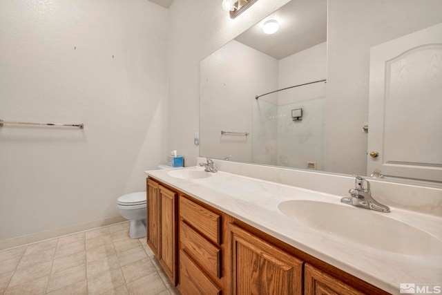 10055 Zephyr Heights Dr, Reno, NV 89521 - full bath featuring a shower, double vanity, toilet, and baseboards