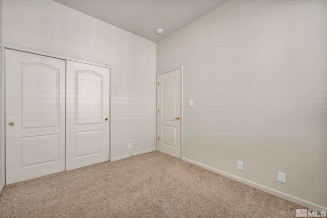 10055 Zephyr Heights Dr, Reno, NV 89521 - unfurnished bedroom featuring carpet flooring, baseboards, and a closet