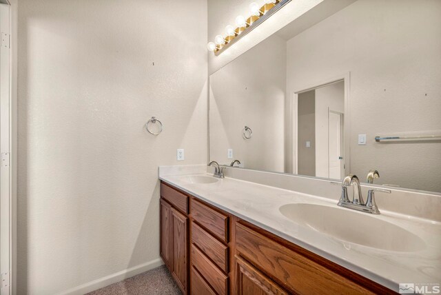 10055 Zephyr Heights Dr, Reno, NV 89521 - full bath featuring double vanity and baseboards