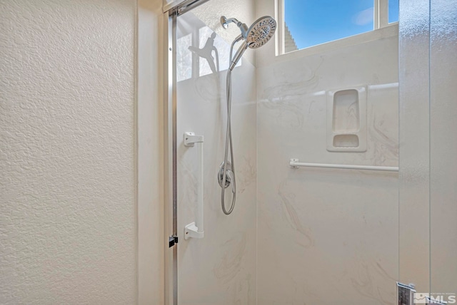 10055 Zephyr Heights Dr, Reno, NV 89521 - bathroom with a textured wall and walk in shower