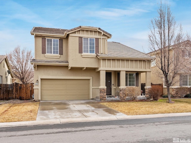 915 Lakeview Dr, Dayton, NV 89403 - view of front of home featuring a garage, stucco siding, concrete driveway, and stone siding