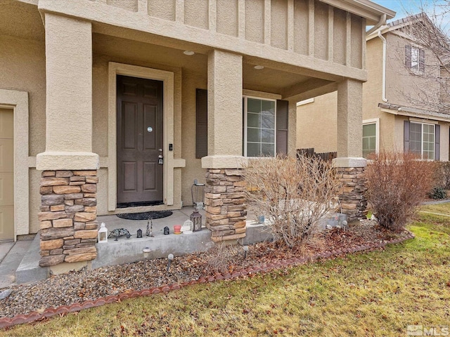 915 Lakeview Dr, Dayton, NV 89403 - property entrance featuring stone siding, stucco siding, and covered porch