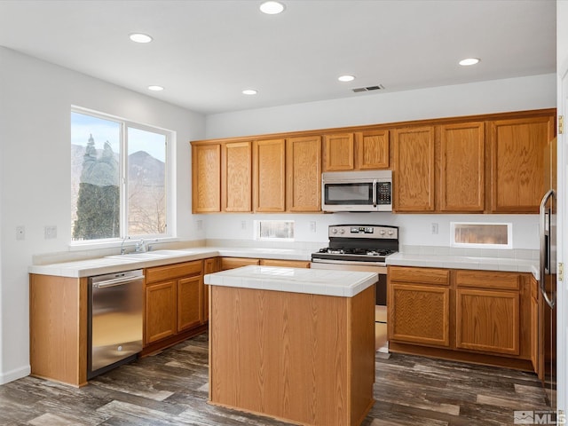 915 Lakeview Dr, Dayton, NV 89403 - kitchen featuring appliances with stainless steel finishes, tile countertops, dark wood-style flooring, recessed lighting, and a sink