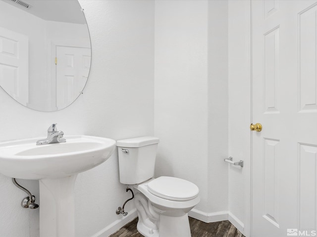 915 Lakeview Dr, Dayton, NV 89403 - bathroom featuring wood finished floors, baseboards, toilet, and a sink