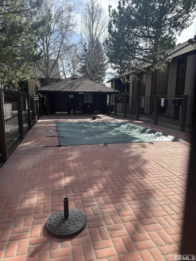 1465 E Peckham Ln Apt 40, Reno, NV 89502 - community pool with fence and a patio
