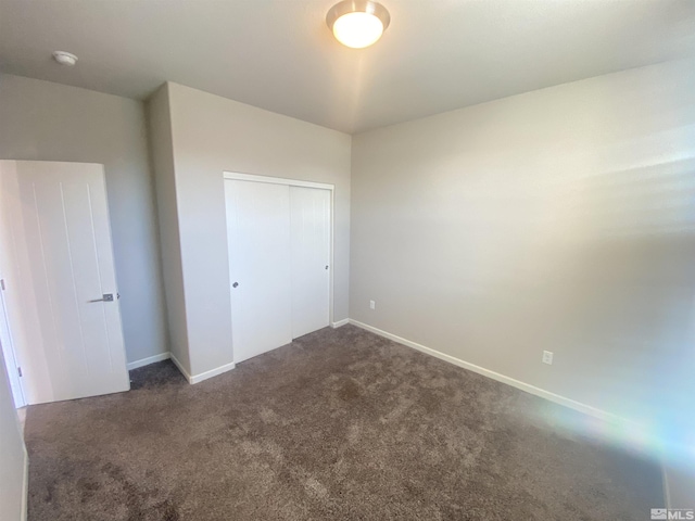 756 Iron Stirrup Ct, Sparks, NV 89436 - unfurnished bedroom featuring dark carpet, a closet, and baseboards
