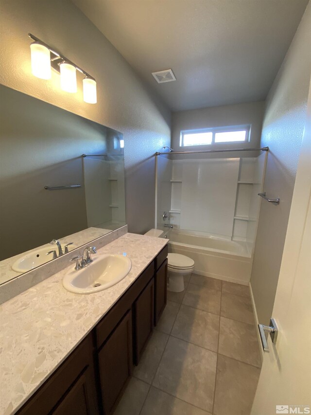 756 Iron Stirrup Ct, Sparks, NV 89436 - bathroom featuring vanity, toilet, tile patterned flooring, and bathing tub / shower combination
