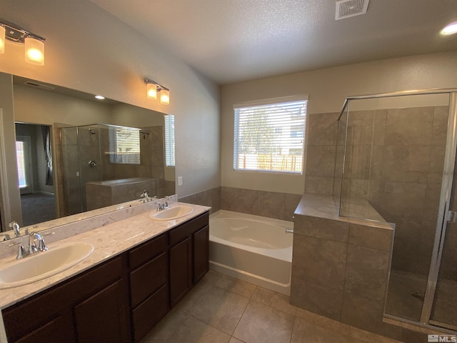 756 Iron Stirrup Ct, Sparks, NV 89436 - bathroom featuring tile patterned flooring, a garden tub, a shower stall, and double vanity