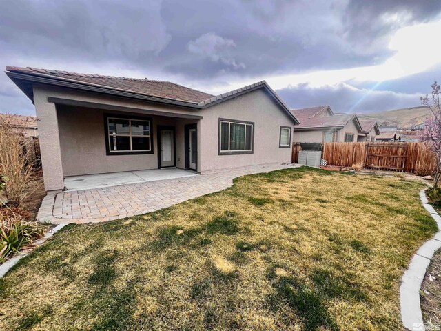 756 Iron Stirrup Ct, Sparks, NV 89436 - rear view of property with a patio area, stucco siding, and a tile roof