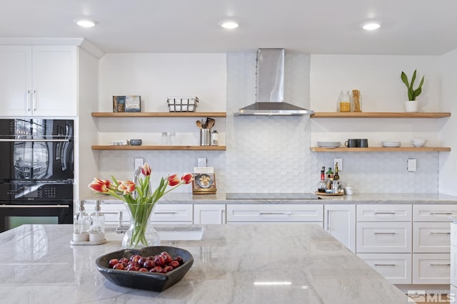 915 Maple Creek Ct, Reno, NV 89511 - kitchen with wall chimney exhaust hood, open shelves, black electric cooktop, white cabinets, and light stone counters