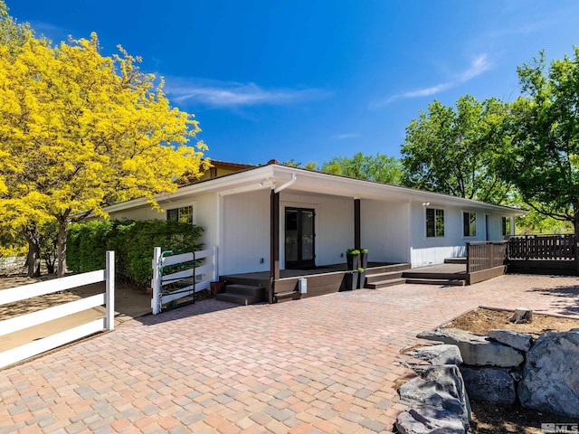 915 Maple Creek Ct, Reno, NV 89511 - view of front of property with fence, a wooden deck, and a patio area