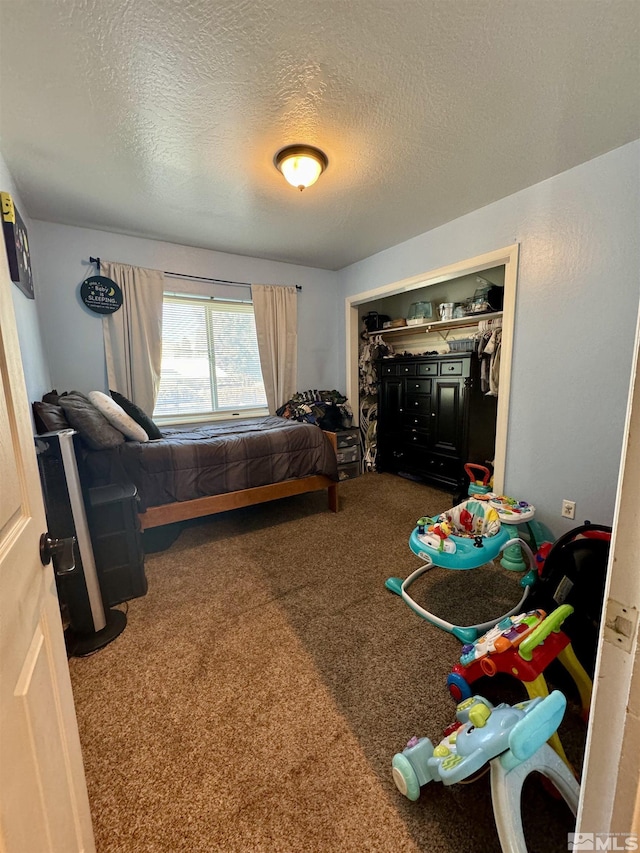 96 E Eisenhower Ave, Winnemucca, NV 89445 - carpeted bedroom with a textured ceiling