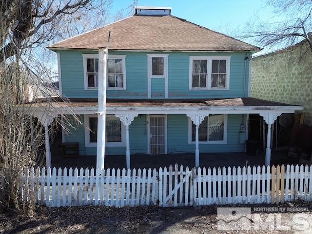 85 S Main, Paradise Valley, NV 89426 - view of front of property featuring a fenced front yard, roof with shingles, and a porch